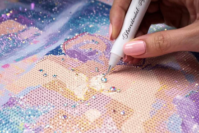 Diamond painting steentje die wordt geplaatst