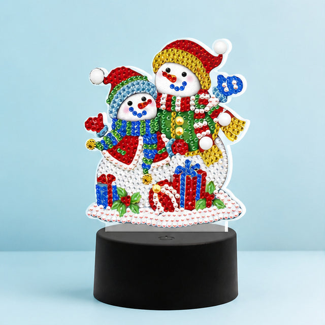 Diamond Painting Lamp Sneeuwmannetjes op een lichtblauwe achtergrond