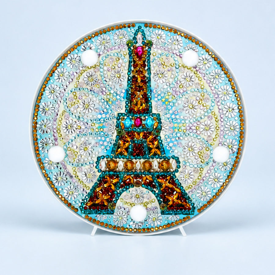 Diamond Painting Rond Lampje Eiffeltoren op een lichtblauwe achtergrond