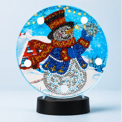 Diamond Painting Rond Lampje Sneeuwman op een lichtblauwe achtergrond
