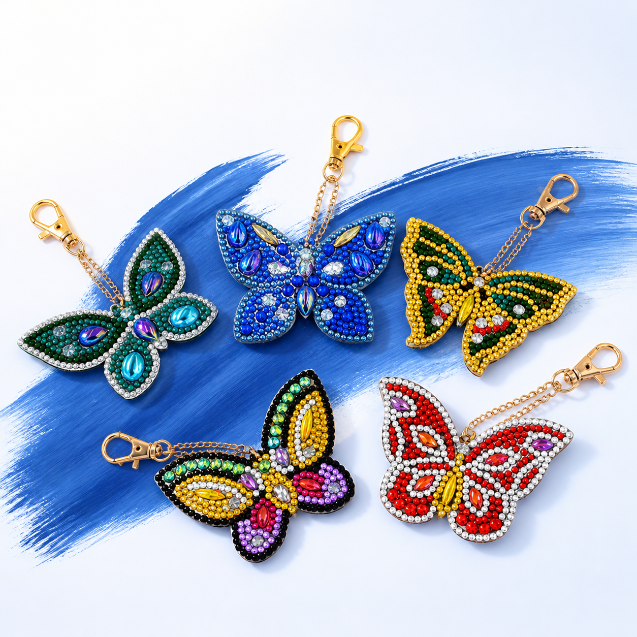 Vijf diamond painting sleutelhangers in de vorm van vlinders